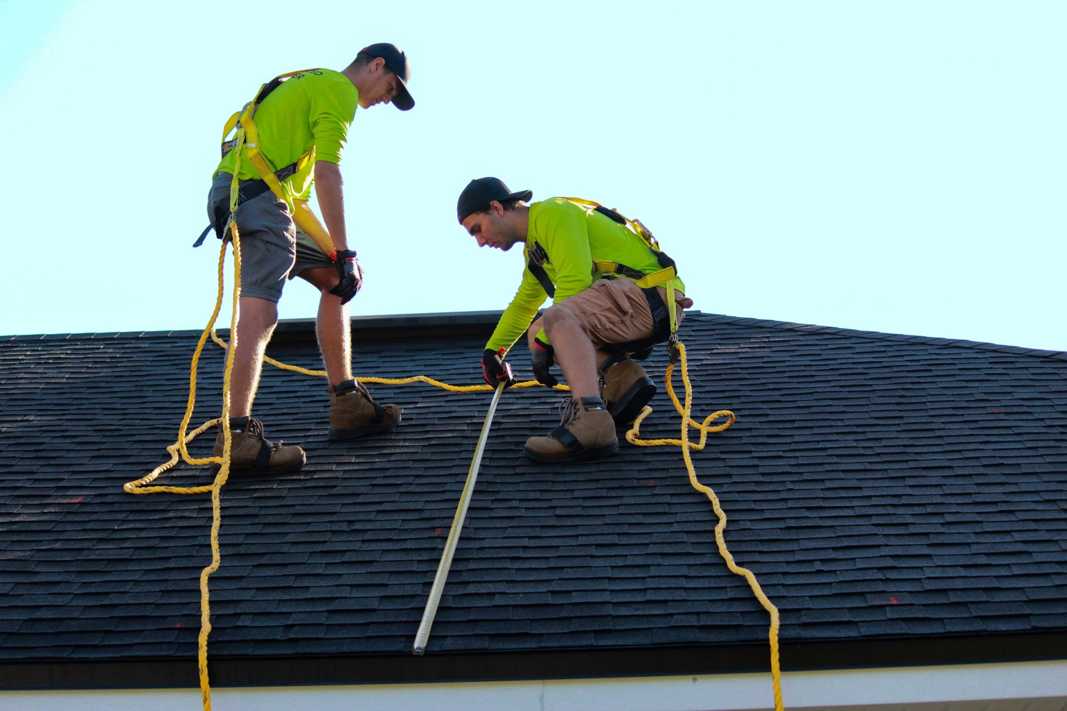Red Stone Roofing team at work on a roof